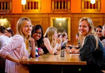 Students chatting and smiling in LMH Dining Hall