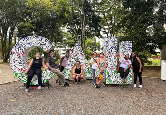 CET Colombia study abroad students pose in front of giant letters spelling "Cali"