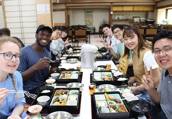 CET Japan study abroad students and local roommates enjoy lunch in a restaurant