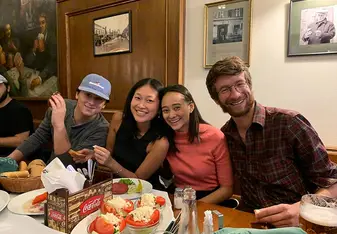 Four CET Prague study abroad students at a restaurant in Prague