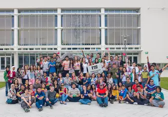 Group shot of FIU ELI students holding their country's flags.