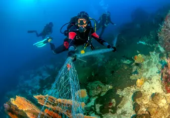 Scuba diver working on marine conservation in Krabi Thailand