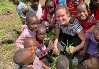 Amanda Drobek smiling with children 