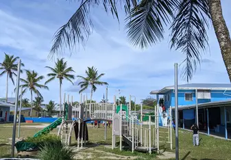 View from behind the play ground looking towards the office building and main road.