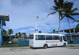 Coop school bus in front of the school