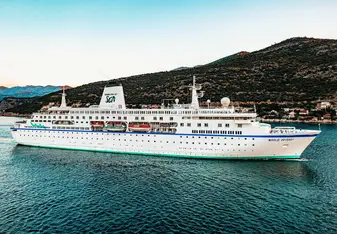 MV World Odyssey sailing into port