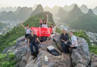 young people after a hike on top of a mountain in guilin