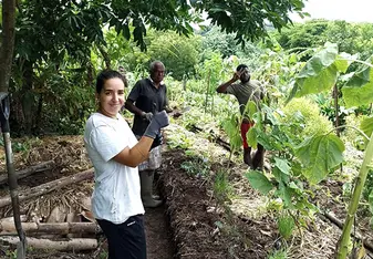 Group standing in vegetable garden 