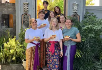 Participants posing with their Balinese offerings Canang Sari 