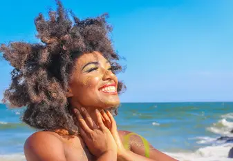 Traveler smiling on the beach