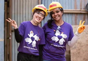 Volunteers wearing purple shirts in Nepal