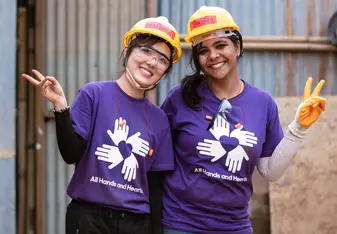 Volunteers wearing purple shirts in Nepal
