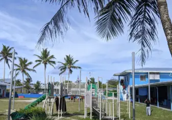 View from behind the play ground looking towards the office building and main road.