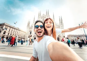 Two Italian for a While gap year students in front of Duomo di Milano
