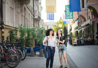 two travelers walking together