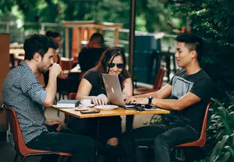 A group of digital nomads working at a cafe