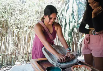 Students engaged in Maya cultural immersive learning in Belize.