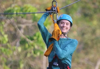 Student explore the rain forest via a zip line course in Belize