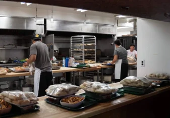 Working in a kitchen at camp