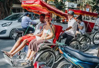 Students riding tuk tuk