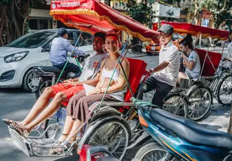 Students riding tuk tuk