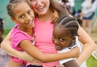 VISIONS Dominican Republic local kids with participant