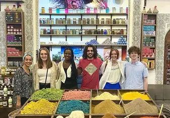 Group of 7 APA Multi-Country students at a spice market in Morocco.