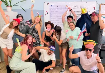 trainees in a classroom at The Language House celebrating their last day