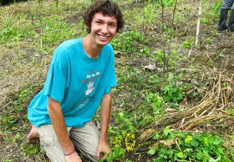 Reforestation Intern Planting Trees
