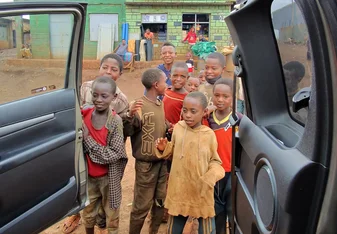 the children are welcoming  their teacher 
