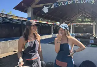 Juliette and friend eating Balinese fruit