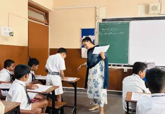 A teacher conversing with their student