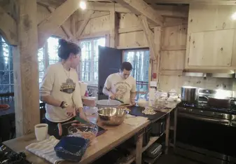 Ella and fellow Seguinland alumni in the kitchen