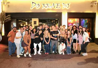 Mickey with friends posing for a photo