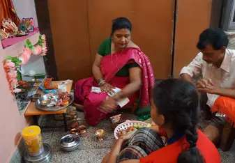 My host family doing puja