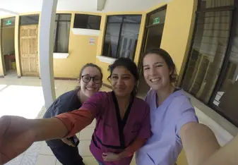 This is a picture of a local nurse, another volunteer and me at the "Puesto de Salud de Santa Lucia" (the medical clinic where I worked) at the end of my trip.