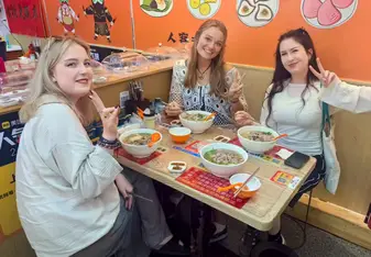 Clara and friends enjoying a meal together