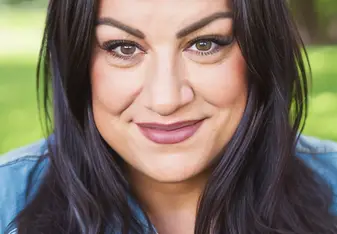 Gina poses for a professional headshot