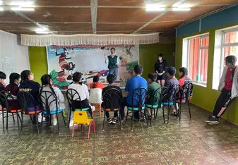 Volunteers teach children through a variety of programs.