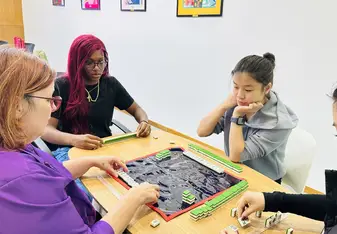 JADE Ambassadors Learning How To Play Majong
