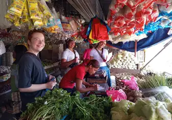Volunteers purchasing ingredients at the public market
