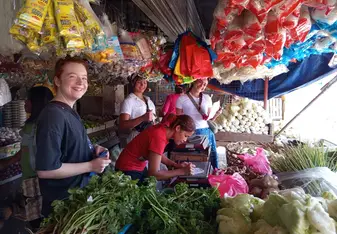 Volunteers purchasing ingredients at the public market