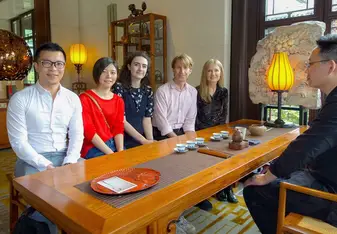 Issy and students enjoy a meeting together