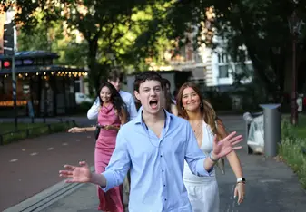 Students walking through Amsterdam on their way to the graduation photoshoot during their study abroad program.
