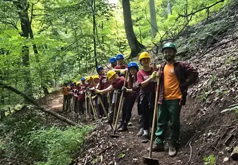Our international volunteer crew on their way back to camp after a long day of hard, rewarding trail work