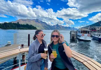 Two girls smiling on a boat in Queenstown