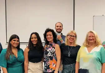 image of a group of smiling faculty and staff