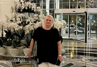 image on a woman standing in a beautiful lobby