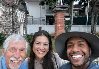 three people smiling 