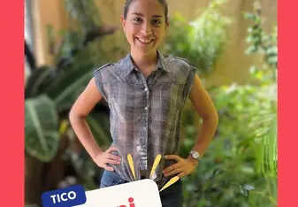 a woman standing and smiling